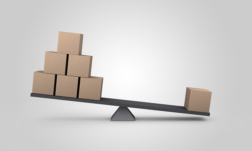 Unbalanced level tipped to one side due to uneven distribution of wooden blocks