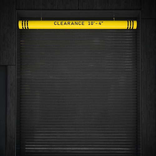 Interior view of glass commercial garage doors in large warehouse