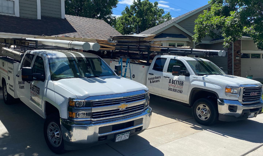 Garage door techs and stocked trucks on the job