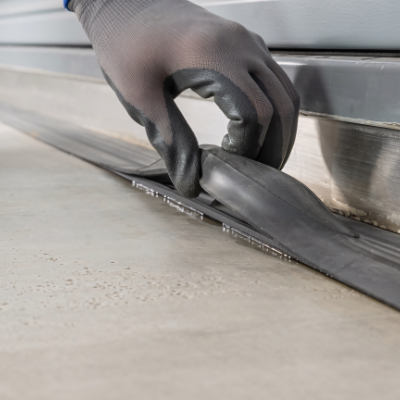 Close-up of garage door bottom seal and side weatherstripping
