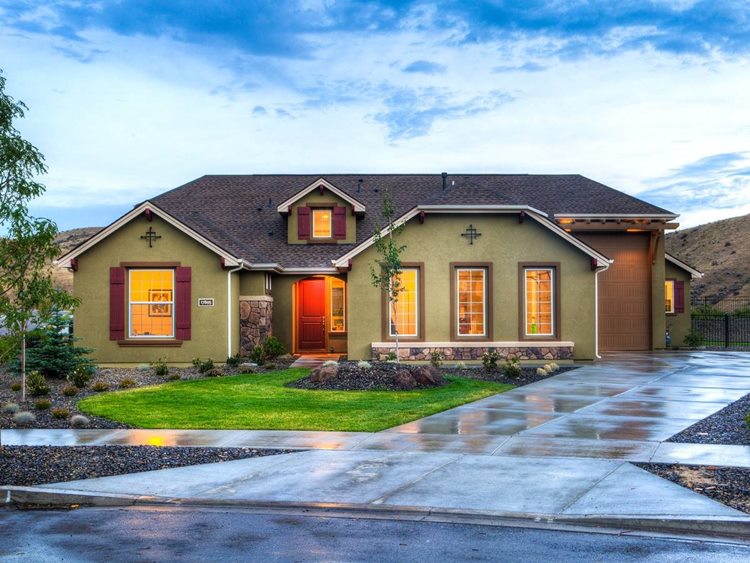 Ranch-style stucco house with modern wooden garage door