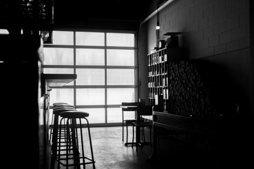 Home bar in remodeled garage with full-view garage door