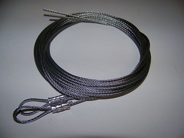 Coiled garage door safety cables prior to installation
