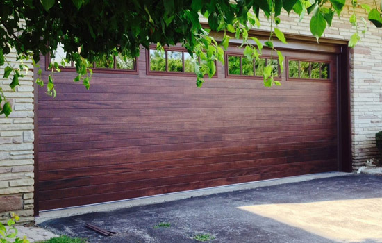 newly installed wood grain garage door