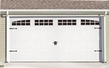 White paneled two-car garage door with windows